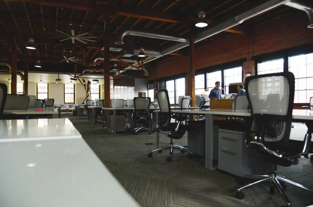 Spacious modern office with industrial design and natural light.