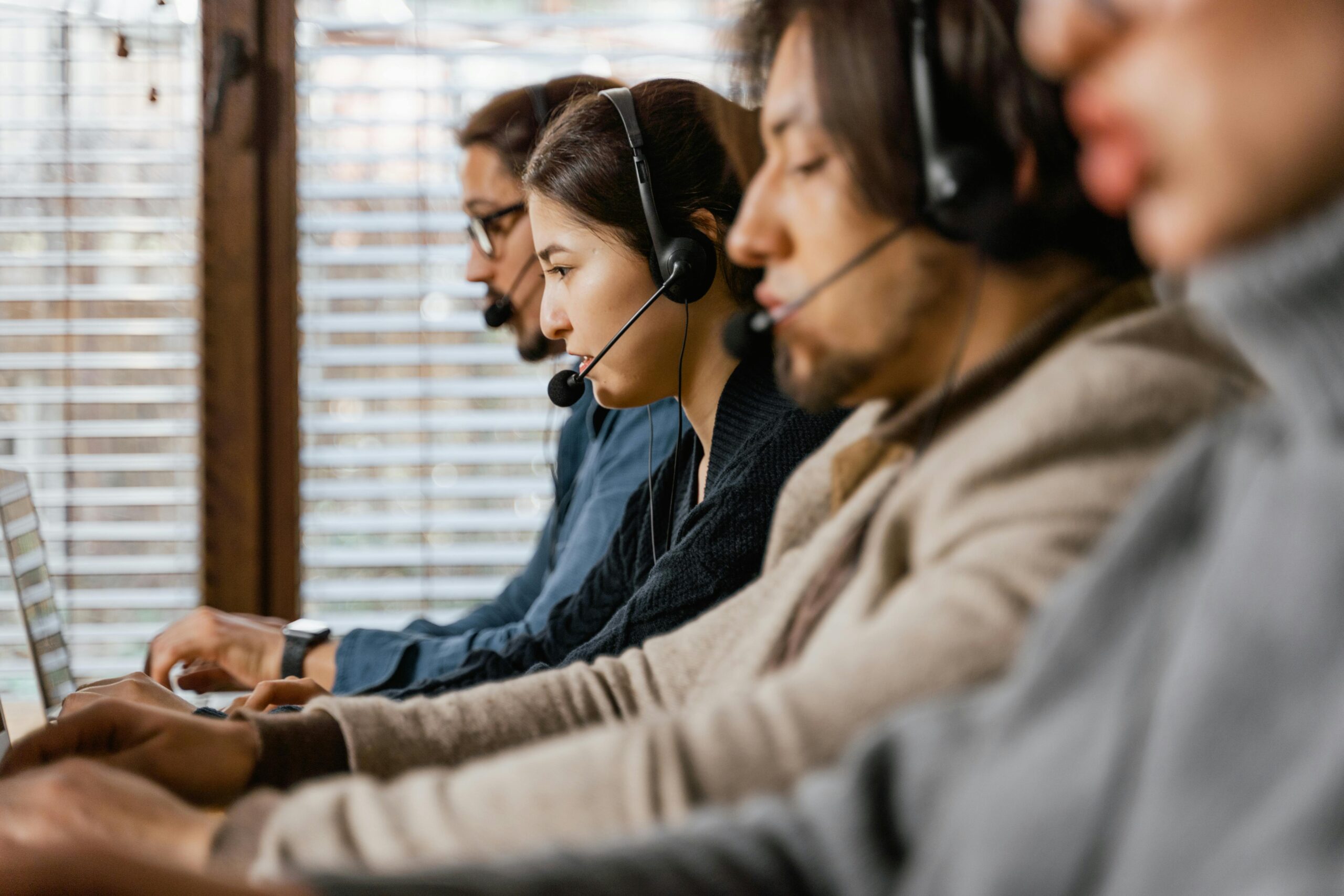Call center employees working with headsets.